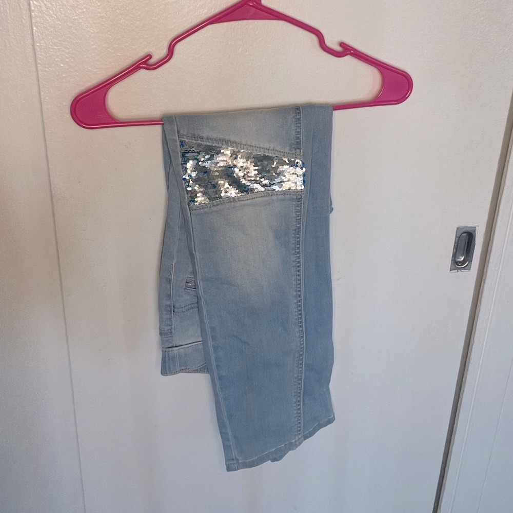 Light wash Justice jeans. For girls.